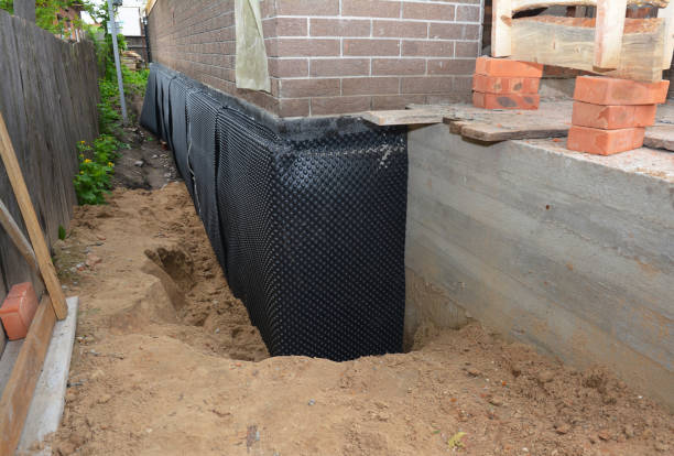 SJ Waterproofing Pros technician performing targeted Exterior Waterproofing assessment in Winn, MI